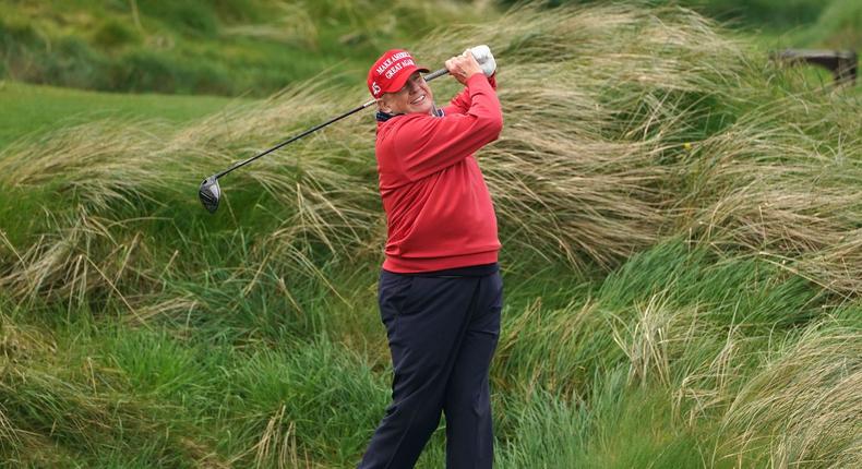 Former President Donald Trump playing golf at his course in Doonbeg, Ireland.Brian Lawless - PA Images/Getty Images
