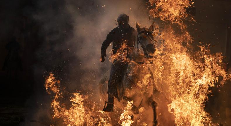 Riding horse through fire