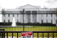 FILE PHOTO: A restricted area sign is seen outside of the White House in Washington