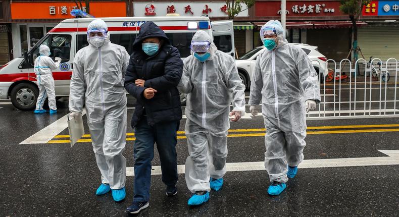 Wuhan China January 26 coronavirus medics help man