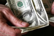 Man's hands hold dollars banknotes money