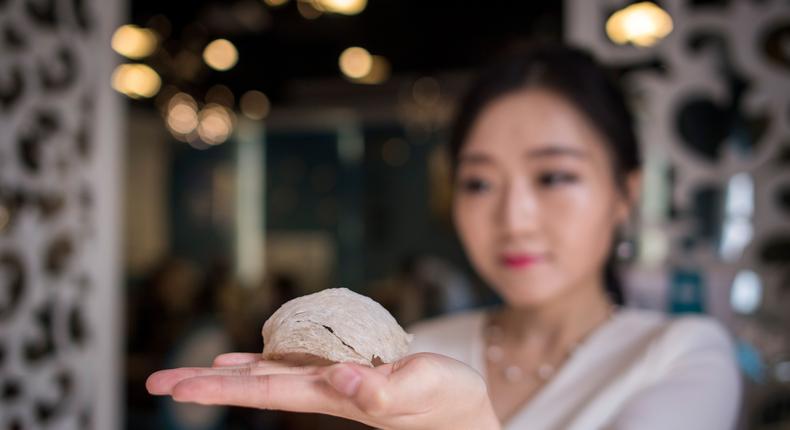 Elaine Zhang, owner of the NestCha restaurant, presenting a dried birds nest, made up of swiftlet saliva, in her restaurant in Shanghai on May 23, 2017.JOHANNES EISELE/AFP via Getty Images