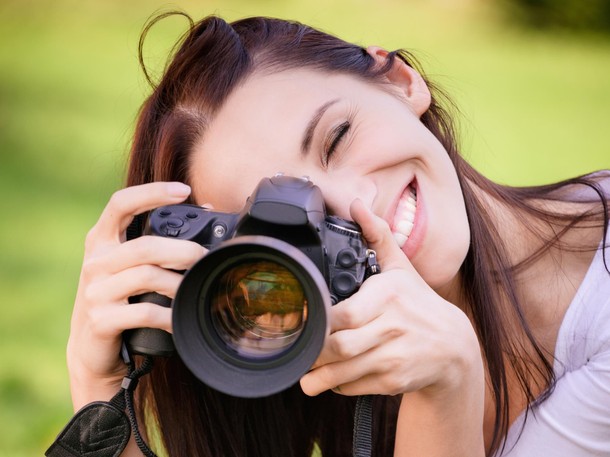 Beautiful girl with camera