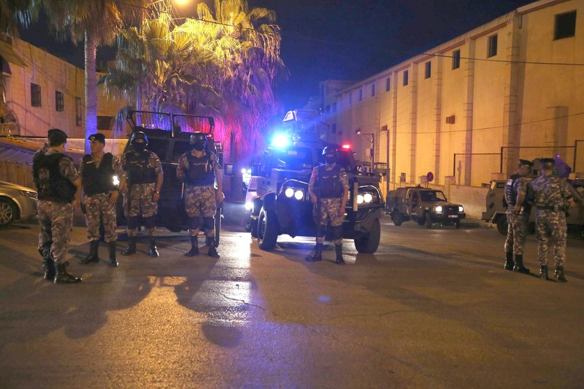 Policemen are seen near the Israeli embassy in Amman