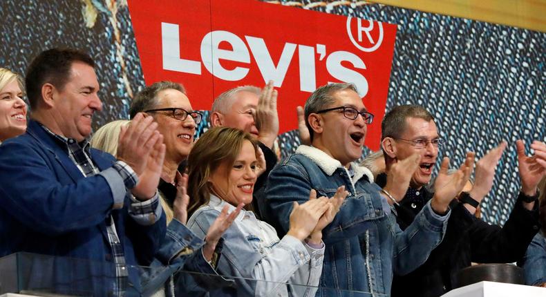 Levi Strauss CEO Chip Bergh, right, is joined by CFO Harmit Singh, second from right, as he rings the New York Stock Exchange opening bell, Thursday, March 21, 2019.AP Photo/Richard Drew