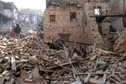 Local residents clear the rubble from their homes which were destroyed after last week's earthquake in Bhaktapur