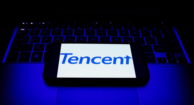 Tencent logo displayed on a phone screen and a laptop keyboard are seen in this illustration photo taken in Krakow, Poland on October 30, 2021.