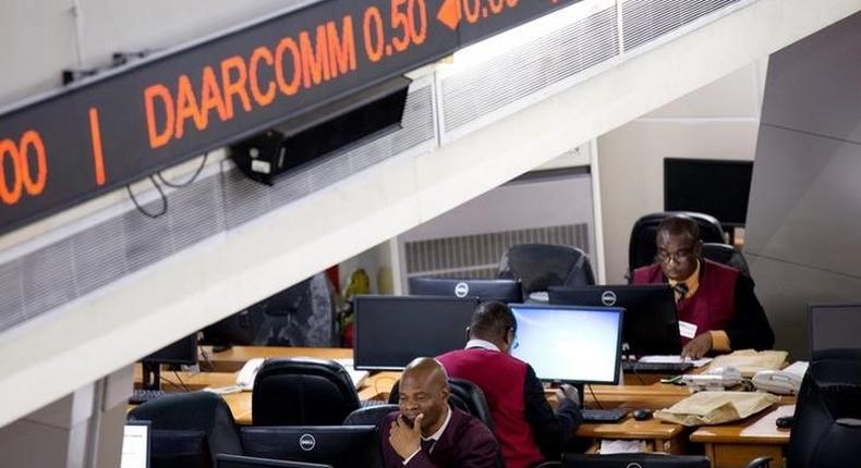 Traders work at the Nigerian Stock Exchange in Lagos, February 13, 2015. REUTERS/Joe Penney