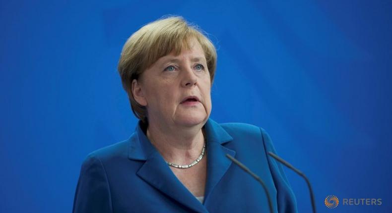 After attacks, Merkel cuts short holiday to face refugee policy storm