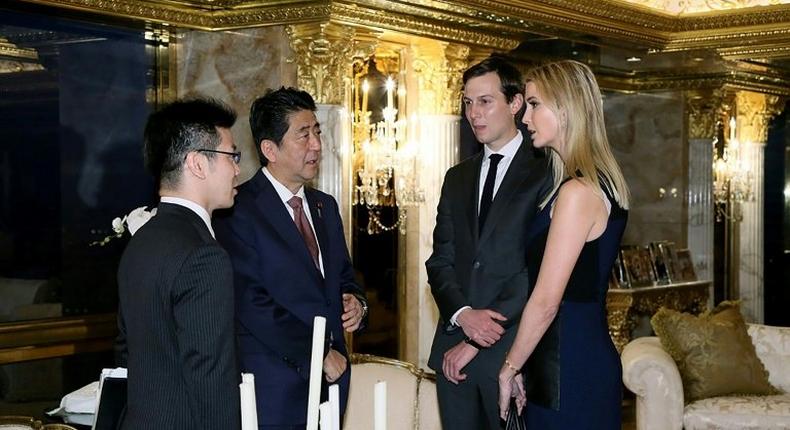 Japanese Prime Minister Shinzo Abe (2nd left) meets Ivanka Trump (right) and her husband Jared Kushner in New York on November 17, 2016