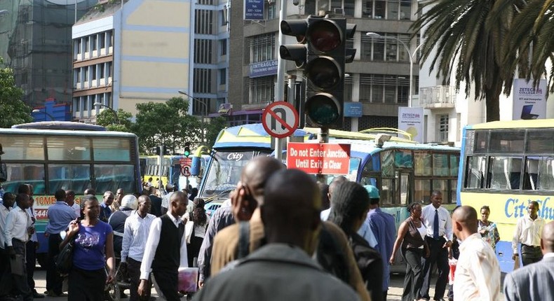 Kenyans on a busy Nairobi street. Mobile loan app services have come up with a new strategy to compel defaulters to pay up their loans