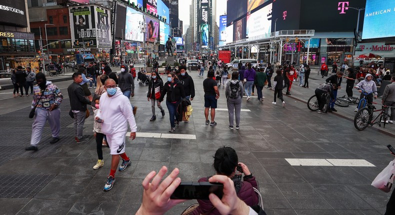 Large crowd of tourists are seen at the Times Square during COVID-19 pandemic in New York City, United States on March 25, 2021.
