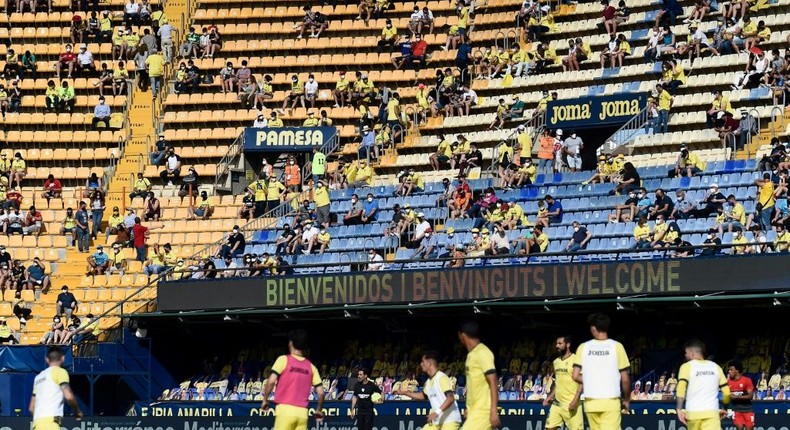 Home again: Villarreal fans watch their team warm up Creator: JOSE JORDAN