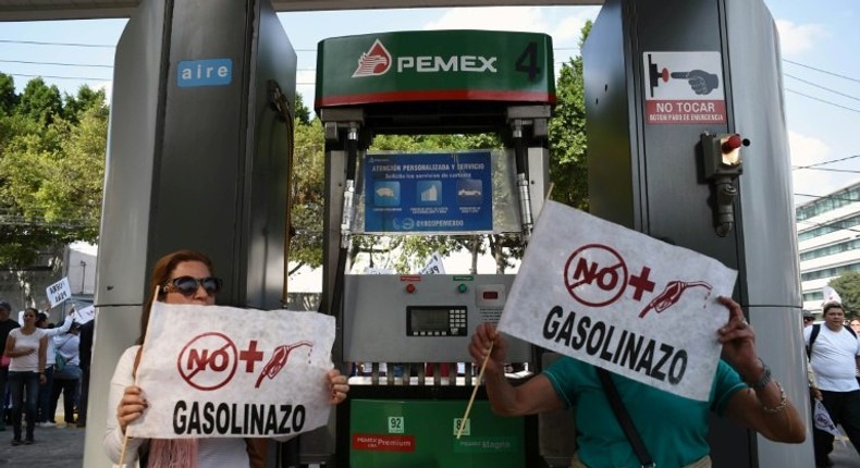 Demonstrators at a petrol station protest the rise in fuel prices in Mexico City on January 1, 2017