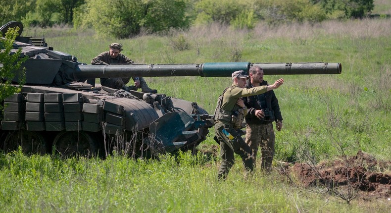 A soldier gives instructions to a tank crew during an exercise in Ukraine on May 5.Viktor Fridshon/Global Images Ukraine via Getty Images