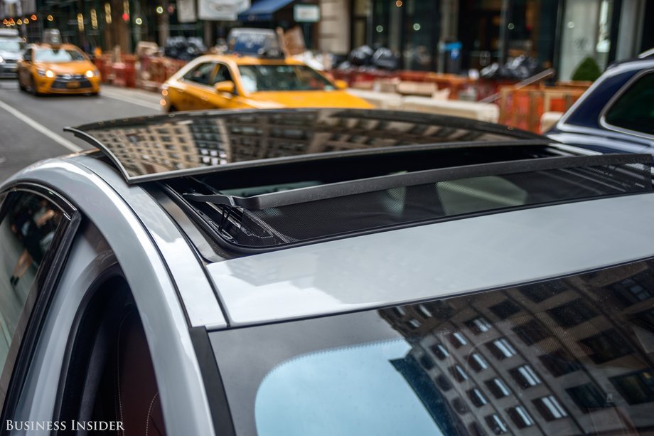 Instead of the roof retracting, the glass panel levers itself up and out of the car.