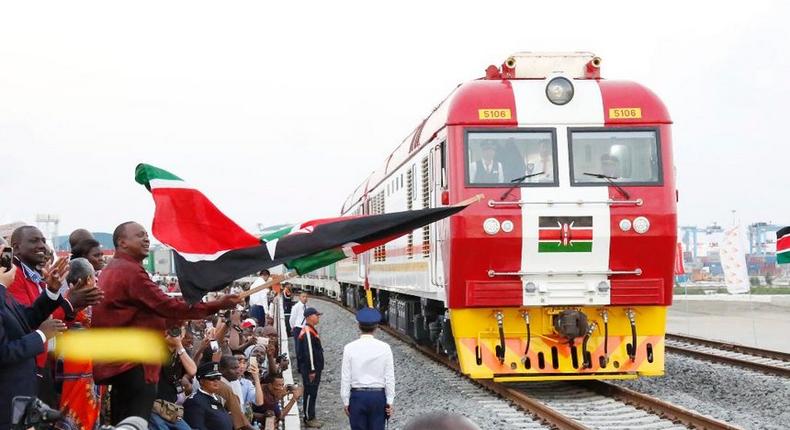 President Uhuru Kenyatta flags off the first cargo train on the Standard Gauge Railway in Mombasa, May 30, 2017. 