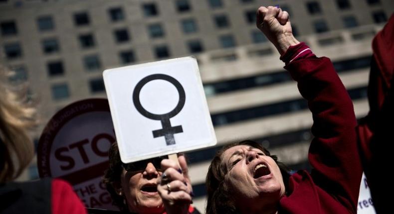 Activists protest the Trump administration and rally for women's rights during a march to honor International Woman's Day on March 8, 2017 in Washington, DC