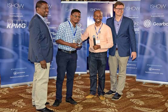 Sign-io’s Founder Roy Allela (center) accepts his trophy from LR Kamau Gachigi (left 