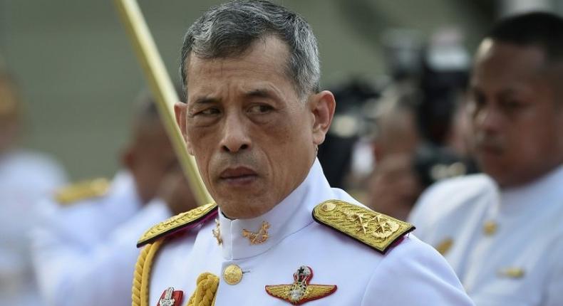 Thailand's King Vajiralongkorn pays respects at the statue of King Rama I after signing the military-backed constitution in Bangkok