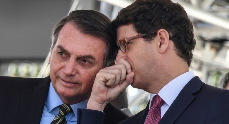 Brazilian President Jair Bolsonaro (L), with his Environment Minister Ricardo Salles in October 2019, has been widely criticized for easing restrictions on exploiting the Amazon's vast riches, leading to an acceleration in deforestation