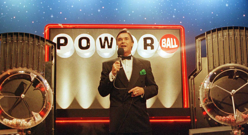 Mike Pace, announcer for the multi-state and District of Columbia Powerball lottery game, announces the winning numbers as they drop into tubes.