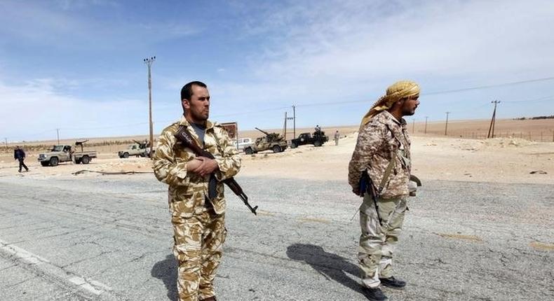 Libyan soldiers man a checkpoint in Wadi Bey, west of the Islamic State-held city of Sirte, February 23, 2016. 