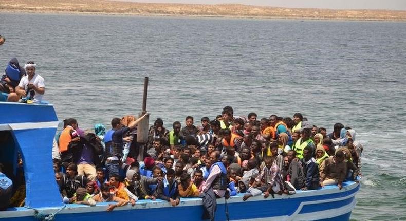 Illegal migrants seen on a boat after being rescued by the Tunisian navy off the coast near Ben Guerdane, Tunisia, June 10, 2015. REUTERS/Stringer