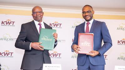 KWFT MD Kariuki Kitabu with AGF Group CEO Jules Ngankam after signing a risk-sharing partnership agreement in Nairobi on May 6, 2024