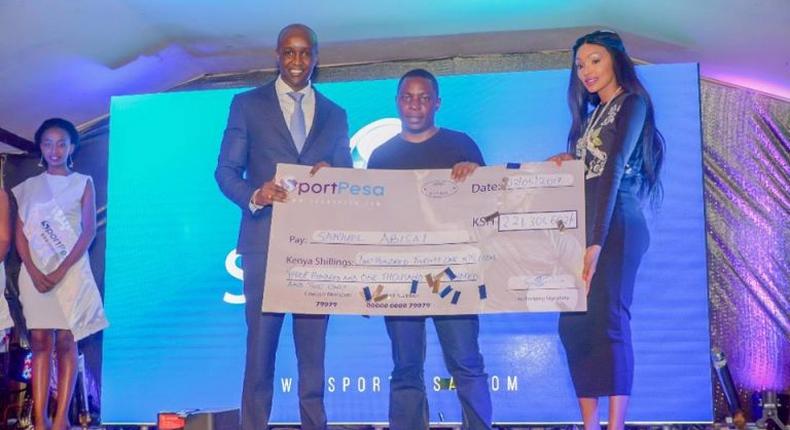 Samuel Abisai receiving  his cheque