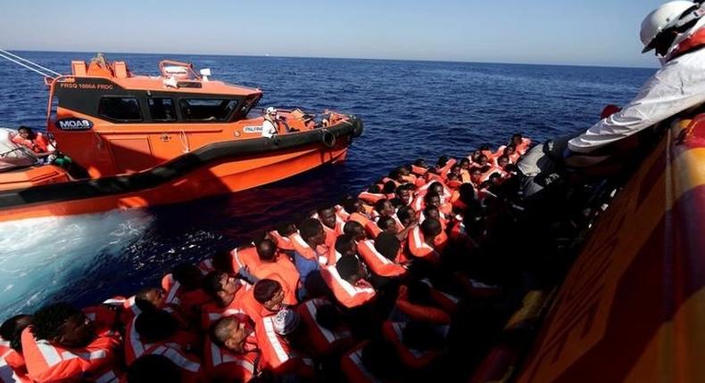 Migrants are seen before embark on Migrant Offshore Aid Station (MOAS) rescue vessel Phoenix during a rescue operations in the international waters between Malta and Libya on August 10,2016. 