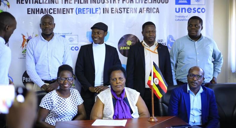 Dr. Ruth Tusasirwe Muguta, Principal Social Development Officer at the Ministry with some of the players in the film industry  addressing press on Thursday