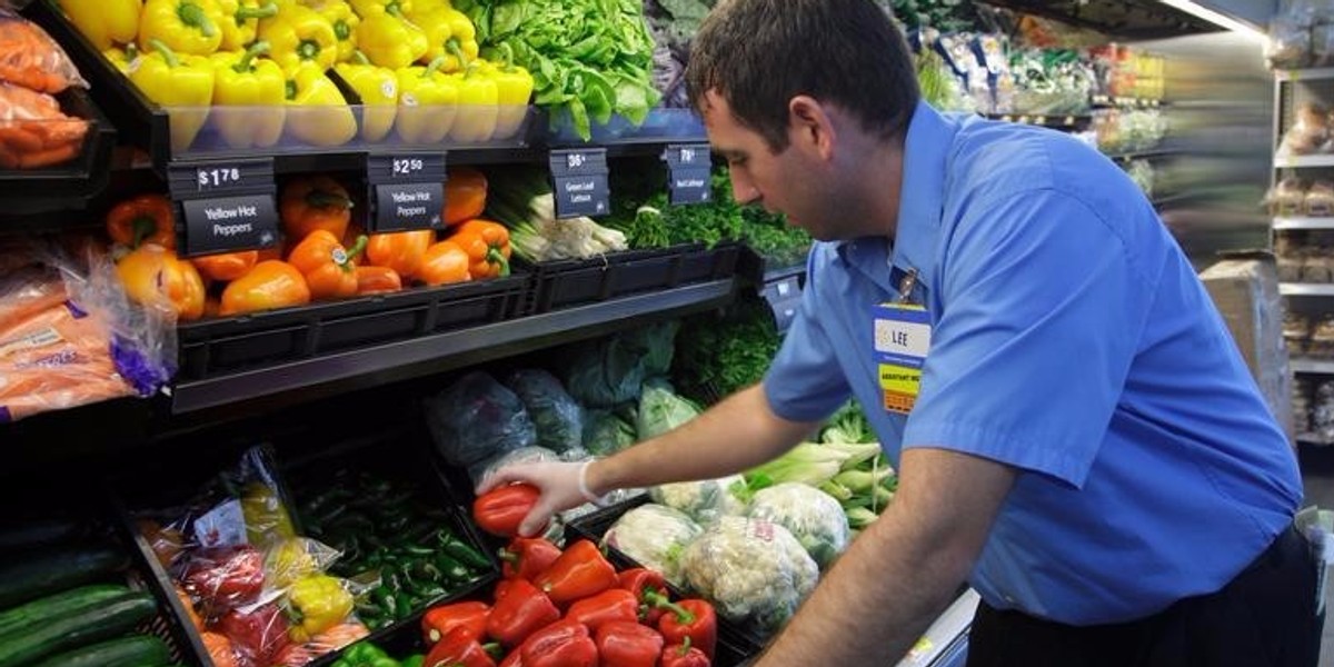 A worker stocks a Walmart Express store in Chicago.