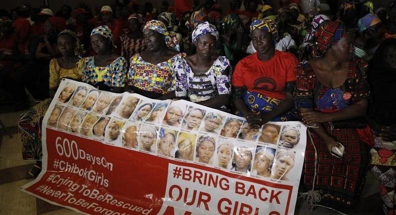 Parents of the Chibok girls hold a Bring Back Our Girls banner during their meeting with Nigeria's President Muhammadu Buhari at the presidential villa in Abuja, Nigeria, January 14, 2016. REUTERS/Afolabi Sotunde