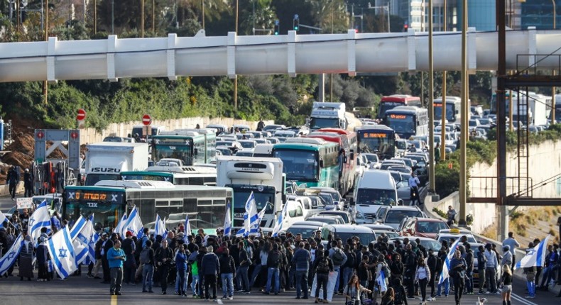 Israelis of Ethiopian origin block Tel Aviv highway as they protest against police violence and racism after an officer shot a young community member dead