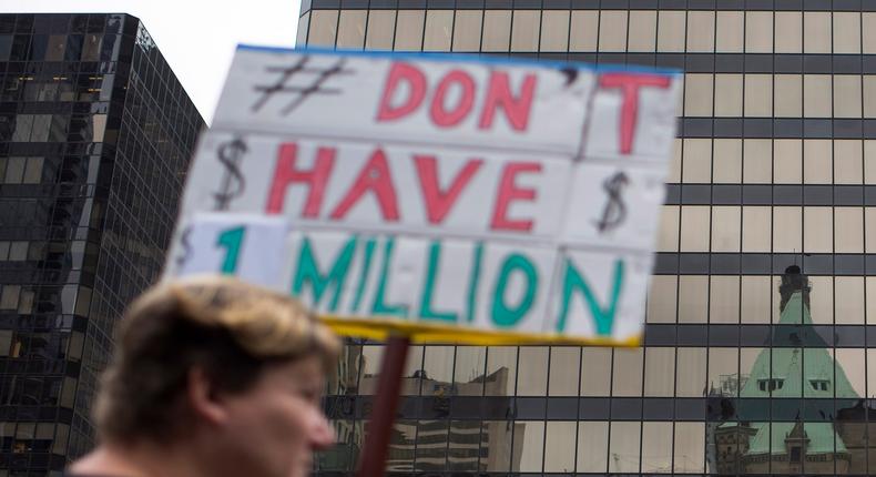 Demonstrators gather protesting against high housing prices for single family homes in downtown Vancouver, British Columbia, May 23, 2015.