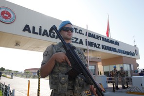 A Turkish soldier stands guard in front of the Aliaga Prison and Courthouse complex in Izmir