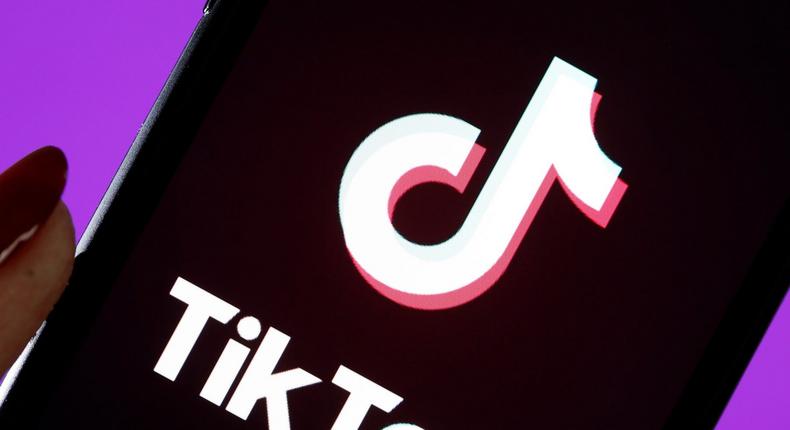 The social media application logo, Tik Tok is displayed on the screen of an iPhone.