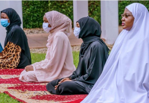 Aisha Buhari joined the president to observe the eid prayers at the Presidential Villa, Abuja. (Punch)