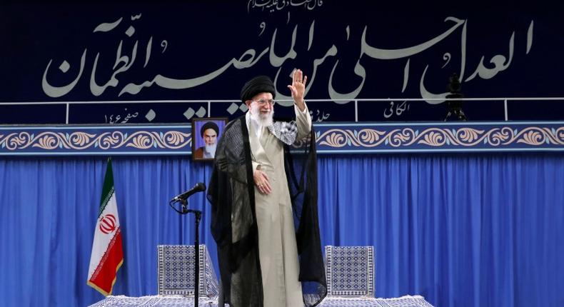 Iran's supreme leader Ayatollah Ali Khamenei waves to the crowd during a gathering in Tehran