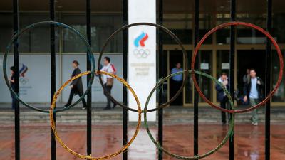 People walk out of the Russian Olympic Committee headquarters in Moscow