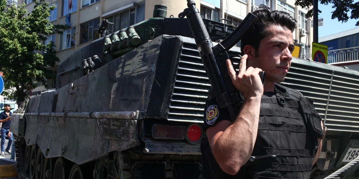 Turkish police stand guard near an abandoned tank in Uskudar District on July 16 in Istanbul.