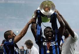 Sulley Muntari lifting the UCL trophy.