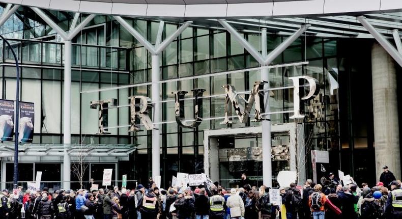 Protesters demonstrate in front of the Trump International Hotel and Tower in Vancouver on its opening day