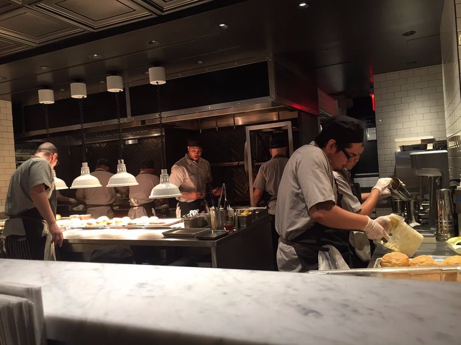 Salvation Burger features an open kitchen so you can watch workers cook the burgers.