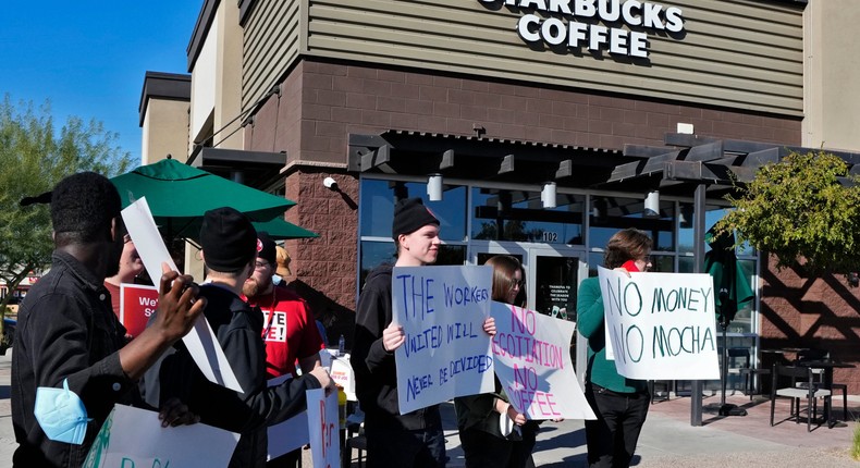 Starbucks employees strike outside their store in November in Mesa, Arizona.Matt York/AP