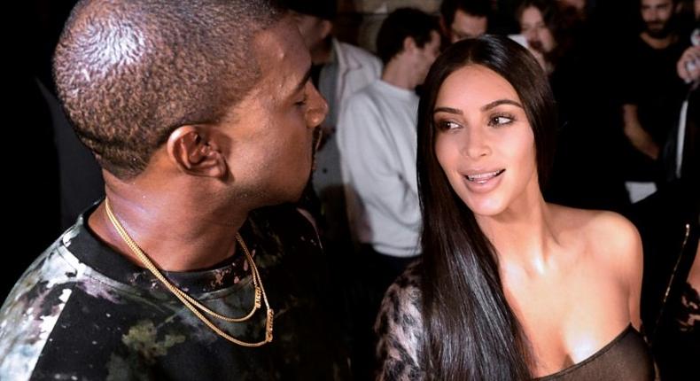 Kanye West and Kim Kardashian (right) pictured at a Paris fashion show on September 29, 2016