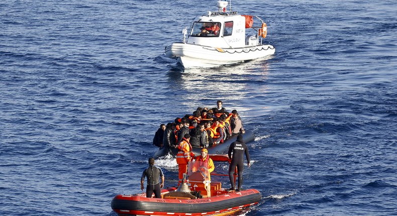 A Turkish Coast Guard fast rigid-hulled inflatable boat tows a dinghy filled with refugees and migrants in the Turkish territorial waters of the North Aegean Sea, following a failed attempt at crossing to the Greek island of Chios, off the shores of Izmir, Turkey, in this February 28, 2016 file photo. TURKEY 