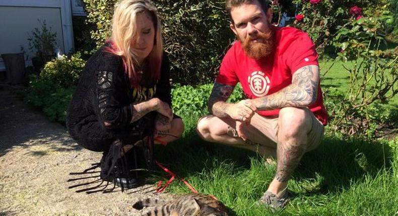 Leah, 30, and Allen Elphick, 28, with their cat Arnold