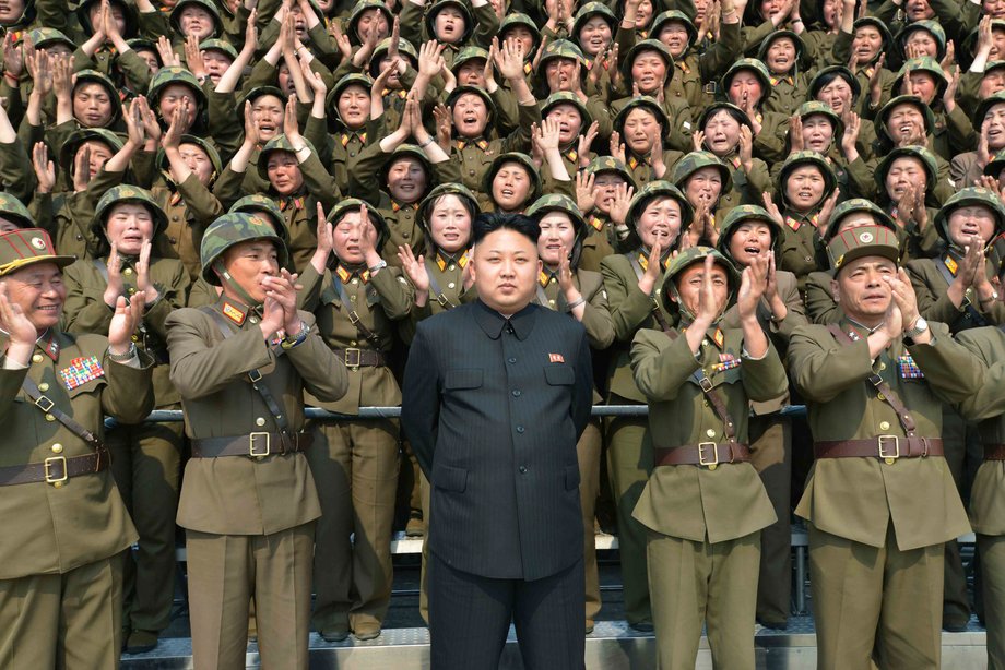 North Korean leader Kim Jong Un receives applause as he guides the multiple-rocket launching drill of women's sub-units under KPA Unit 851, in this undated photo released by North Korea's Korean Central News Agency (KCNA) April 24, 2014.